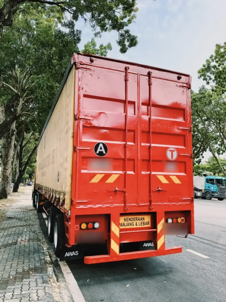 Red curtain-side trailer, rear view